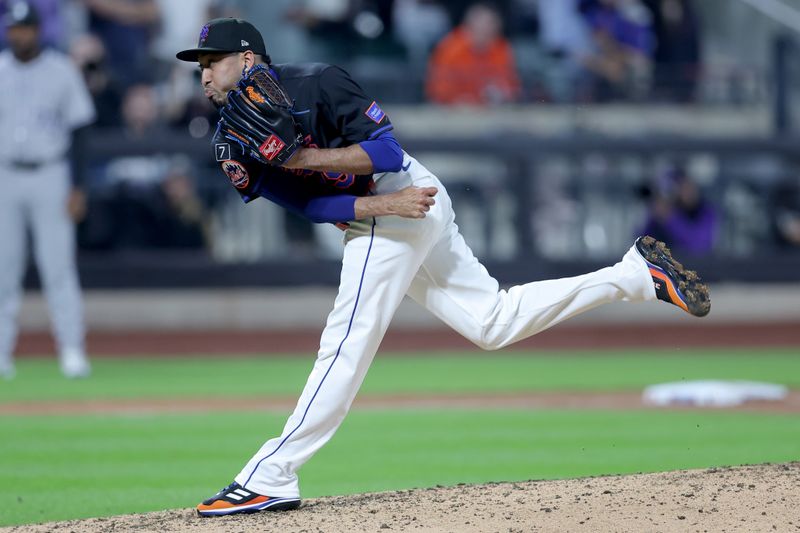 May 30, 2025; New York City, New York, USA; New York Mets relief pitcher Edwin Diaz (39) follows through on a pitch against the Colorado Rockies during the ninth inning at Citi Field. Mandatory Credit: Brad Penner-Imagn Images