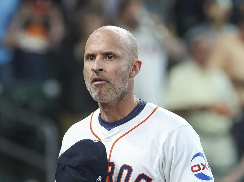 Apr 3, 2024; Houston, Texas, USA; Houston Astros manager Joe Espada walks to the dugout before the game against the Toronto Blue Jays at Minute Maid Park. Mandatory Credit: Troy Taormina-USA TODAY Sports