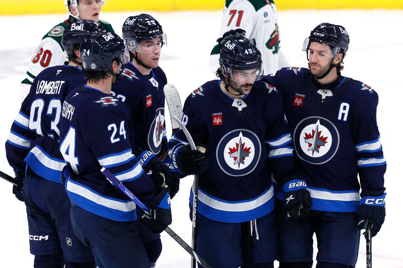 Sep 21, 2024; Winnipeg, Manitoba, CAN; Winnipeg Jets Forward Colby Barlow celebrates his third period goal against the Minnesota Wild at Canada Life Centre. Mandatory Credit: James Carey Lauder-Imagn Images