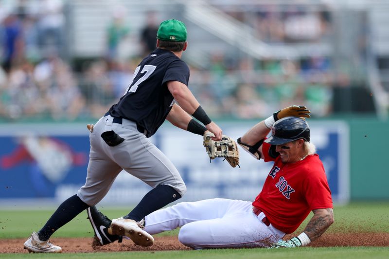 Mar 17, 2024; Fort Myers, Florida, USA;  Boston Red Sox left fielder Jarren Duran (16) slides into second base after hitting a double against the New York Yankees in the first inning at JetBlue Park at Fenway South. Mandatory Credit: Nathan Ray Seebeck-USA TODAY Sports