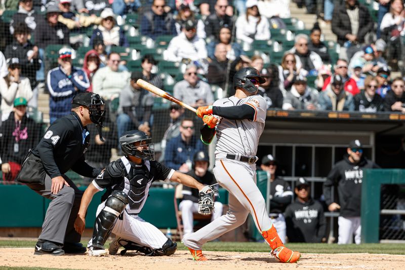 Apr 6, 2023; Chicago, Illinois, USA; San Francisco Giants first baseman Joc Pederson (23) hits a two-run single against the Chicago White Sox during the fourth inning at Guaranteed Rate Field. Mandatory Credit: Kamil Krzaczynski-USA TODAY Sports