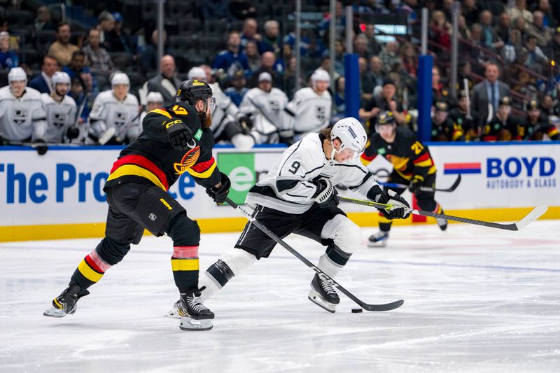 Mar 25, 2024; Vancouver, British Columbia, CAN; Vancouver Canucks defenseman Filip Hronek (17) stick checks Los Angeles Kings forward Adrian Kempe (9) in the second period at Rogers Arena. Mandatory Credit: Bob Frid-USA TODAY Sports