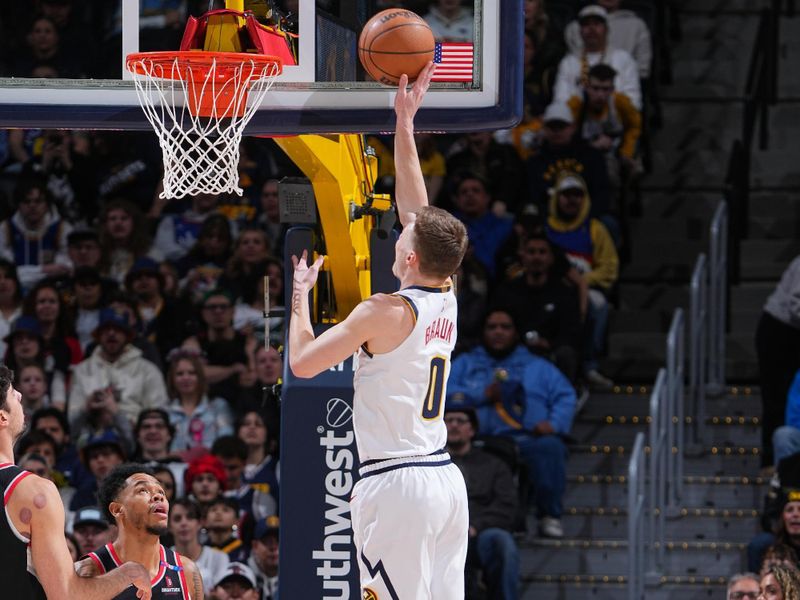 DENVER, CO - FEBRUARY 10: Christian Braun #0 of the Denver Nuggets drives to the basket during the game against the Portland Trail Blazers on February 10, 2025 at Ball Arena in Denver, Colorado. NOTE TO USER: User expressly acknowledges and agrees that, by downloading and/or using this Photograph, user is consenting to the terms and conditions of the Getty Images License Agreement. Mandatory Copyright Notice: Copyright 2025 NBAE (Photo by Garrett Ellwood/NBAE via Getty Images)