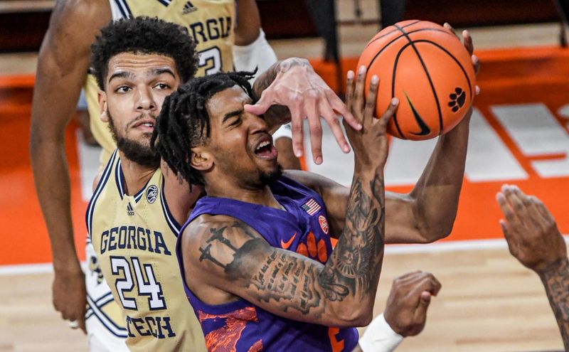 Jan 24, 2023; Clemson, South Carolina, USA; Clemson Tigers guard Dillon Hunter (2) moves to the basket against Georgia Tech Yellow Jackets center Rodney Howard (24) during the first half at Littlejohn Coliseum. Mandatory Credit: Ken Ruinard-USA TODAY Sports