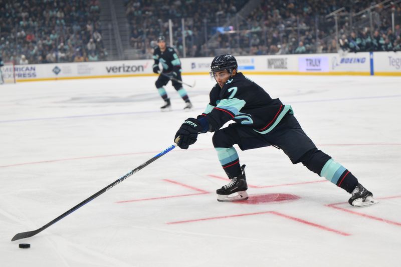 Nov 2, 2023; Seattle, Washington, USA; Seattle Kraken right wing Jordan Eberle (7) reaches for the puck during the first period against the Nashville Predators at Climate Pledge Arena. Mandatory Credit: Steven Bisig-USA TODAY Sports