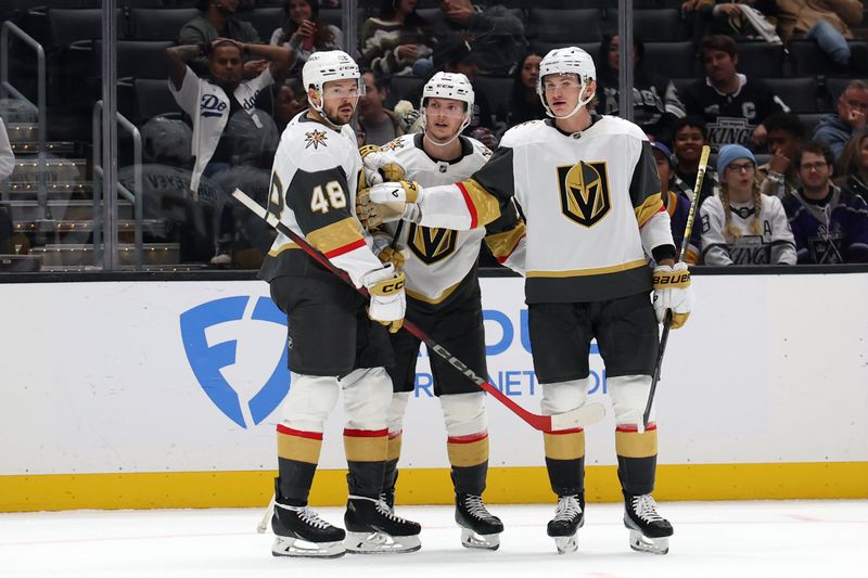 Oct 30, 2024; Los Angeles, California, USA; Vegas Golden Knights left wing Pavel Dorofeyev (16, center) celebrates with teammates after scoring a goal during the third period against the Los Angeles Kings at Crypto.com Arena. Mandatory Credit: Kiyoshi Mio-Imagn Images