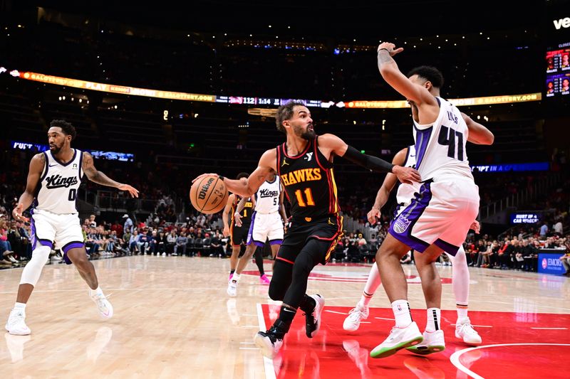 ATLANTA, GA - NOVEMBER 1: Trae Young #11 of the Atlanta Hawks handles the ball during the game against the Sacramento Kings on November 1, 2024 at State Farm Arena in Atlanta, Georgia.  NOTE TO USER: User expressly acknowledges and agrees that, by downloading and/or using this Photograph, user is consenting to the terms and conditions of the Getty Images License Agreement. Mandatory Copyright Notice: Copyright 2024 NBAE (Photo by Adam Hagy/NBAE via Getty Images)