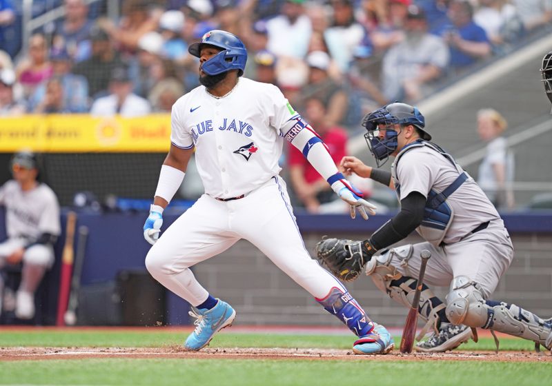 Jun 30, 2024; Toronto, Ontario, CAN; Toronto Blue Jays first base Vladimir Guerrero Jr. (27) reacts after hitting a single against the New York Yankees during the first inning at Rogers Centre. Mandatory Credit: Nick Turchiaro-USA TODAY Sports