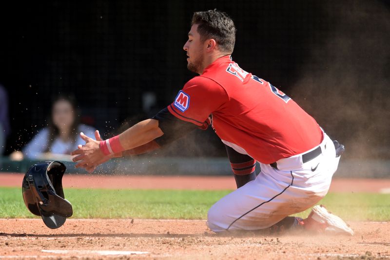 Sep 17, 2023; Cleveland, Ohio, USA; Cleveland Guardians third baseman Tyler Freeman (2) scores during the fourth inning against the Texas Rangers at Progressive Field. Mandatory Credit: Ken Blaze-USA TODAY Sports