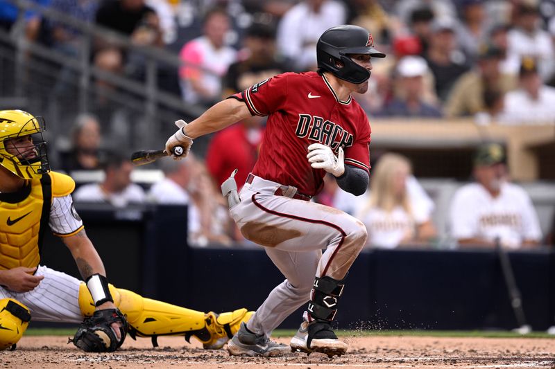 Aug 19, 2023; San Diego, California, USA; Arizona Diamondbacks right fielder Corbin Carroll (7) hits a single against the San Diego Padres during the third inning at Petco Park. Mandatory Credit: Orlando Ramirez-USA TODAY Sports