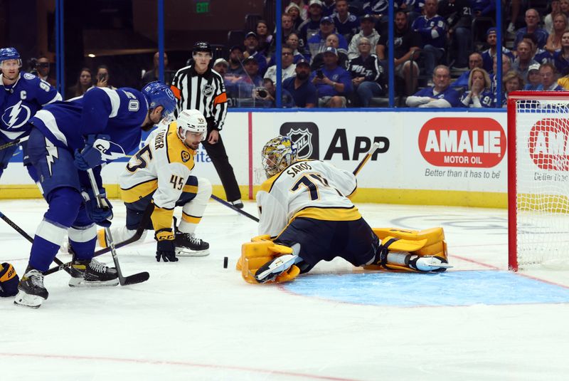 Oct 10, 2023; Tampa, Florida, USA; Tampa Bay Lightning left wing Nicholas Paul (20) shoots on Nashville Predators goaltender Juuse Saros (74)  during the third period at Amalie Arena. Mandatory Credit: Kim Klement Neitzel-USA TODAY Sports