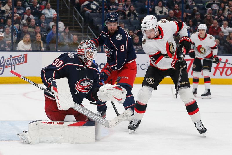 Dec 1, 2023; Columbus, Ohio, USA; Columbus Blue Jackets goalie Elvis Merzlikins (90) makes a save as Ottawa Senators right wing Drake Batherson (19) looks for a rebound during the third period at Nationwide Arena. Mandatory Credit: Russell LaBounty-USA TODAY Sports