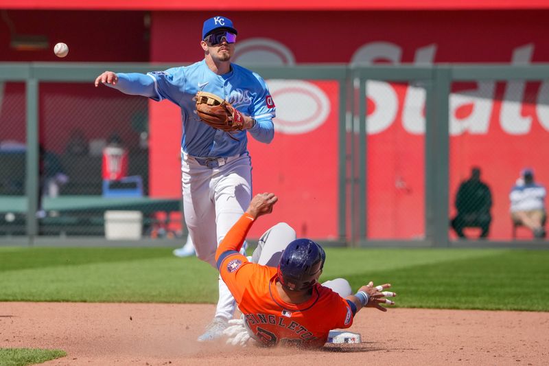 Apr 11, 2024; Kansas City, Missouri, USA; Kansas City Royals second base Nick Loftin (12) gets the out on Houston Astros first base Jon Singleton (28) at second base and throws to first in the sixth inning at Kauffman Stadium. Mandatory Credit: Denny Medley-USA TODAY Sports