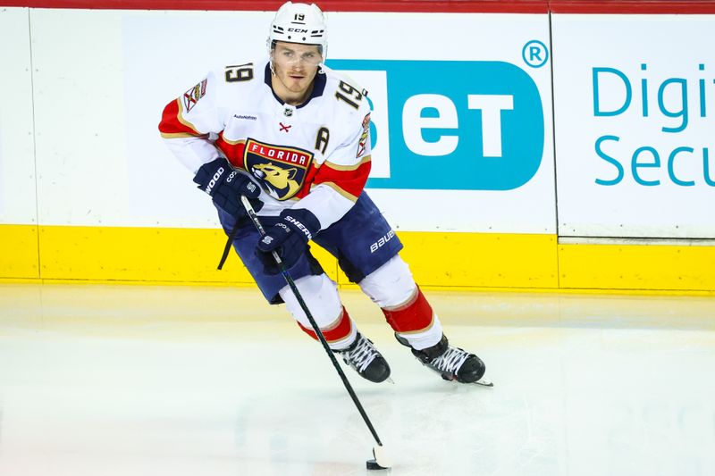 Dec 14, 2024; Calgary, Alberta, CAN; Florida Panthers left wing Matthew Tkachuk (19) skates with the puck during the warmup period against the Calgary Flames at Scotiabank Saddledome. Mandatory Credit: Sergei Belski-Imagn Images