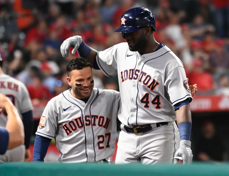 Apr 7, 2022; Anaheim, California, USA; Houston Astros designated hitter Yordan Alvarez (44) is congratulated by second baseman Jose Altuve (27) after hitting a solo home run in the eighth inning against the Los Angeles Angels at Angel Stadium. Mandatory Credit: Jayne Kamin-Oncea-USA TODAY Sports