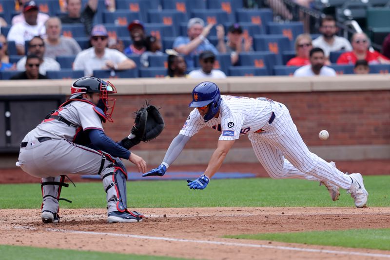 Jul 28, 2024; New York City, New York, USA; Atlanta Braves catcher Travis d'Arnaud (16) waits for the ball before tagging out New York Mets center fielder Tyrone Taylor (15) trying to score from second base on a single by New York Mets left fielder Ben Gamel (not pictured) during the fifth inning at Citi Field. Mandatory Credit: Brad Penner-USA TODAY Sports