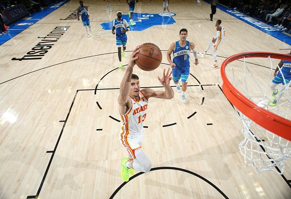 MILWAUKEE, WI - DECEMBER 2: Bogdan Bogdanovic #13 of the Atlanta Hawks drives to the basket during the game against the Milwaukee Bucks  on December 2, 2023 at the Fiserv Forum Center in Milwaukee, Wisconsin. NOTE TO USER: User expressly acknowledges and agrees that, by downloading and or using this Photograph, user is consenting to the terms and conditions of the Getty Images License Agreement. Mandatory Copyright Notice: Copyright 2023 NBAE (Photo by Gary Dineen/NBAE via Getty Images).