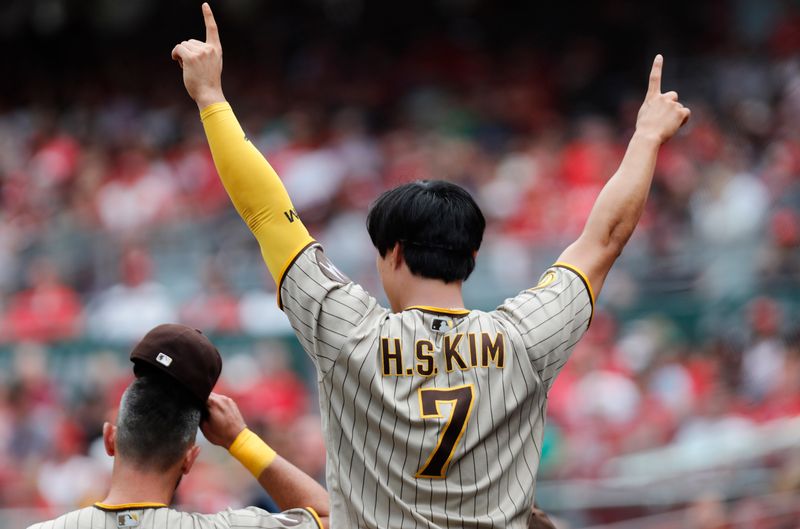 Jul 2, 2023; Cincinnati, Ohio, USA; San Diego Padres second baseman Ha-Seong Kim (7) reacts after right fielder Fernando Tatis Jr. (not pictured) hit a solo home run against the Cincinnati Reds during the eighth inning at Great American Ball Park. Mandatory Credit: David Kohl-USA TODAY Sports