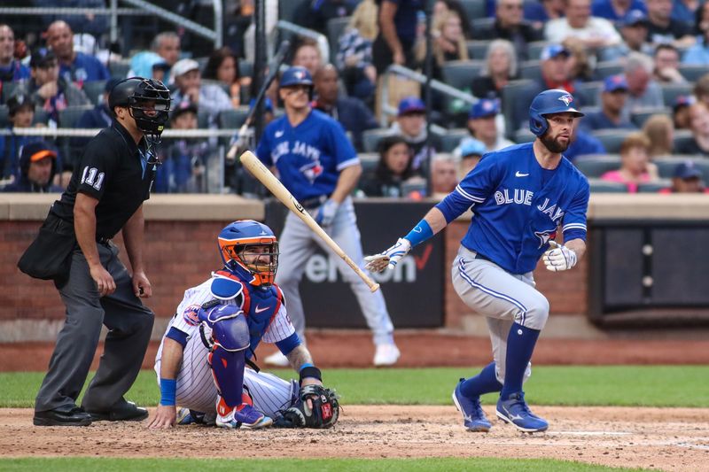 Jun 3, 2023; New York City, New York, USA;  Toronto Blue Jays designated hitter Brandon Belt (13) hits a double in the sixth inning against the New York Mets at Citi Field. Mandatory Credit: Wendell Cruz-USA TODAY Sports