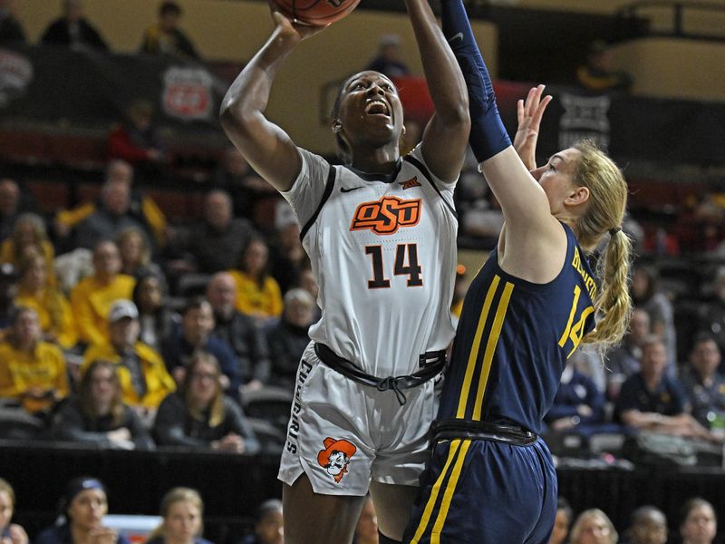 Mar 10, 2023; Kansas City, MO, USA;  Oklahoma State Cowgirls forward Taylen Collins (14) drives to the basket against West Virginia Mountaineers forward Kylee Blacksten (14) during the first half at Municipal Auditorium. Mandatory Credit: Peter Aiken-USA TODAY Sports