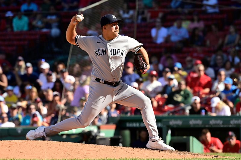 Sep 14, 2023; Boston, Massachusetts, USA; New York Yankees relief pitcher Greg Weissert (85) pitches against the Boston Red Sox during the fifth inning at Fenway Park. Mandatory Credit: Eric Canha-USA TODAY Sports