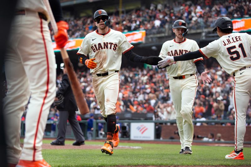 Apr 26, 2025; San Francisco, California, USA; San Francisco Giants second baseman Christian Koss and catcher Sam Huff get a congratulatory handshake from center fielder Jung Hoo Lee (51) after scoring on a single by San Francisco Giants shortstop Willy Adames (2) against the Texas Rangers during the fifth inning at Oracle Park. Mandatory Credit: D. Ross Cameron-Imagn Images