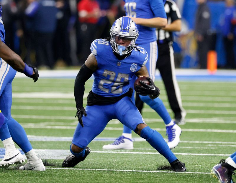 Detroit Lions running back Jahmyr Gibbs (26) carries the ball against the Los Angeles Rams during the first half of an NFL wild-card playoff football game Sunday, Jan. 14, 2024 in Detroit. (AP Photo/Duane Burleson)