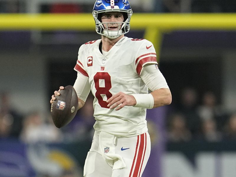 New York Giants quarterback Daniel Jones (8) runs down the field during the first half of an NFL wild-card football game against the Minnesota Vikings, Sunday, Jan. 15, 2023, in Minneapolis. (AP Photo/Abbie Parr)