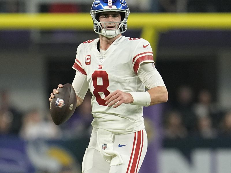 New York Giants quarterback Daniel Jones (8) runs down the field during the first half of an NFL wild-card football game against the Minnesota Vikings, Sunday, Jan. 15, 2023, in Minneapolis. (AP Photo/Abbie Parr)