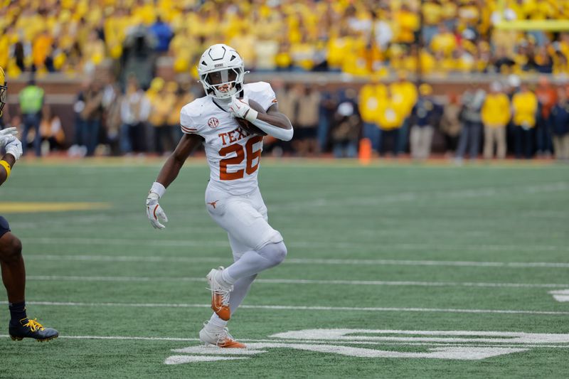 Sep 7, 2024; Ann Arbor, Michigan, USA; Texas Longhorns running back Quintrevion Wisner (26) rushes in the first half against the Michigan Wolverines at Michigan Stadium. Mandatory Credit: Rick Osentoski-Imagn Images