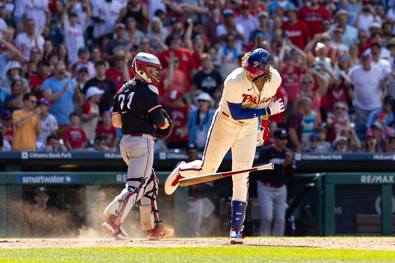 Aug 13, 2023; Philadelphia, Pennsylvania, USA; Philadelphia Phillies first baseman Alec Bohm (28) slams his bat to the ground in front of Minnesota Twins catcher Ryan Jeffers (27) after being called out on a strike to end the seventh inning at Citizens Bank Park. Mandatory Credit: Bill Streicher-USA TODAY Sports