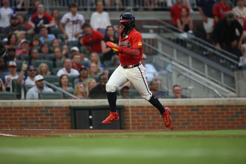 Apr 19, 2024; Atlanta, Georgia, USA; Atlanta Braves outfielder Ronald Acuna Jr. (13) scores a run against the Texas Rangers in the first inning at Truist Park. Mandatory Credit: Brett Davis-USA TODAY Sports
