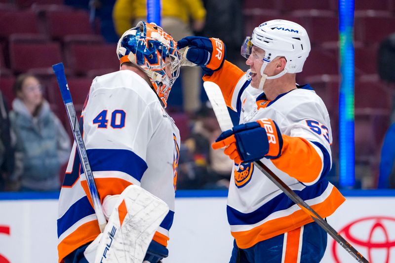 Nov 14, 2024; Vancouver, British Columbia, CAN; New York Islanders goalie Semyon Varlamov (40) and forward Casey Cizikas (53) celebrate their victroy against the Vancouver Canucks at Rogers Arena. Mandatory Credit: Bob Frid-Imagn Images