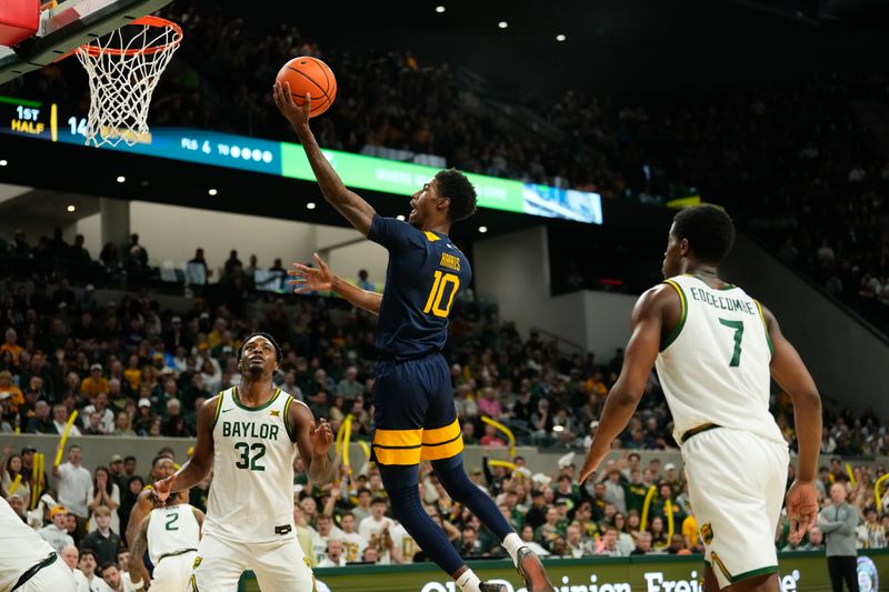 Feb 15, 2025; Waco, Texas, USA; West Virginia Mountaineers guard Sencire Harris (10) scores a layup ahead of Baylor Bears guard VJ Edgecombe (7) during the first half at Paul and Alejandra Foster Pavilion. Mandatory Credit: Chris Jones-Imagn Images