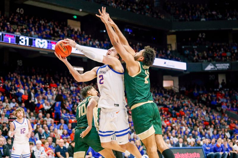 Jan 9, 2024; Boise, Idaho, USA; Boise State Broncos forward Tyson Degenhart (2) drives the ball against Colorado State Rams guard Rashaan Mbemba (21) during the second half at ExtraMile Arena. Mandatory Credit: Brian Losness-USA TODAY Sports