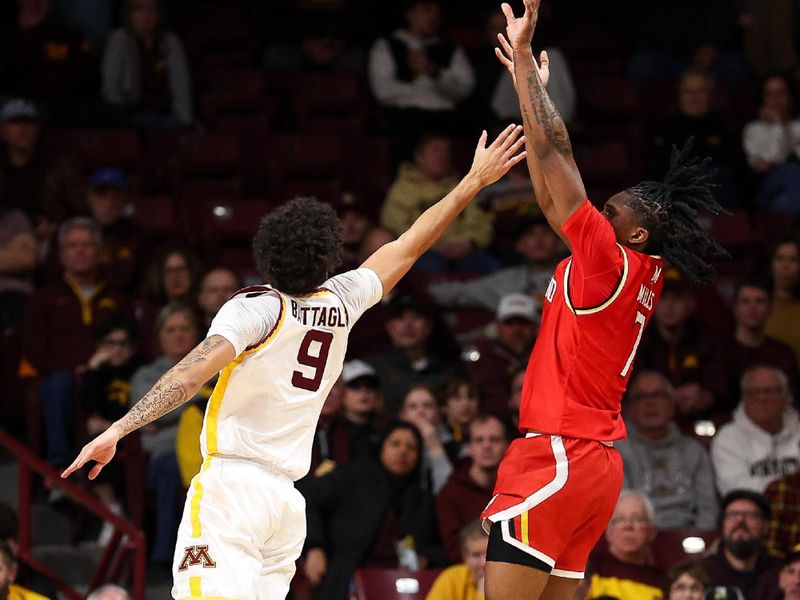 Feb 8, 2026; Minneapolis, Minnesota, USA; Maryland Terrapins guard Andre Mills (7) shoots over Minnesota Golden Gophers guard Kai Shinholster (9) during the first half at Williams Arena. Mandatory Credit: Matt Krohn-Imagn Images