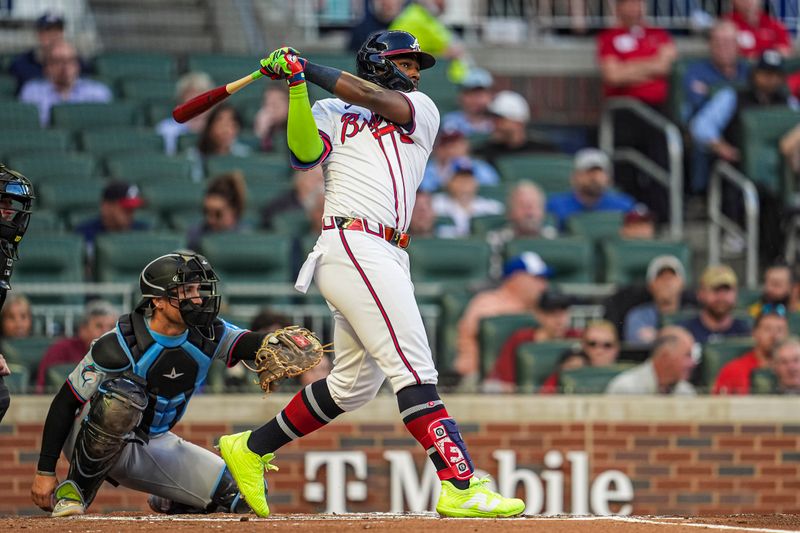 Apr 23, 2024; Cumberland, Georgia, USA; Atlanta Braves outfielder Michael Harris II (23) hits a double to drive in a run against the Miami Marlins during the second inning at Truist Park. Mandatory Credit: Dale Zanine-USA TODAY Sports