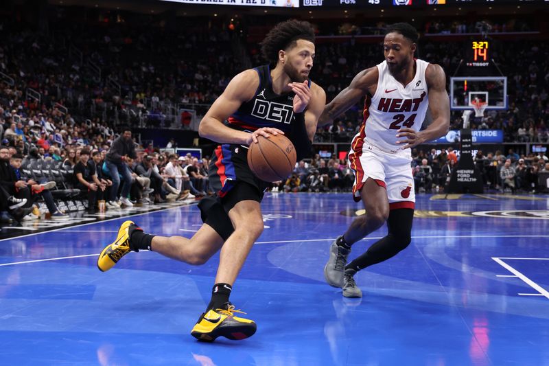 DETROIT, MICHIGAN - NOVEMBER 12: Cade Cunningham #2 of the Detroit Pistons drives around Haywood Highsmith #24 of the Miami Heat during the second half in the first round of the Emirates NBA Cup at Little Caesars Arena on November 12, 2024 in Detroit, Michigan. NOTE TO USER: User expressly acknowledges and agrees that, by downloading and or using this photograph, User is consenting to the terms and conditions of the Getty Images License. (Photo by Gregory Shamus/Getty Images)