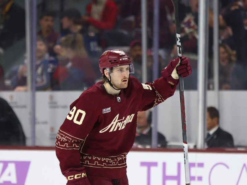 Nov 30, 2023; Tempe, Arizona, USA; Arizona Coyotes defenseman J.J. Moser (90) celebrates a goal against the Colorado Avalanche in the second period at Mullett Arena. Mandatory Credit: Mark J. Rebilas-USA TODAY Sports