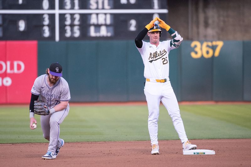 May 21, 2024; Oakland, California, USA; Oakland Athletics outfielder Brent Rooker (25) motions to his team mates after hitting a double against the Colorado Rockies during the fourth inning at Oakland-Alameda County Coliseum. Mandatory Credit: Ed Szczepanski-USA TODAY Sports