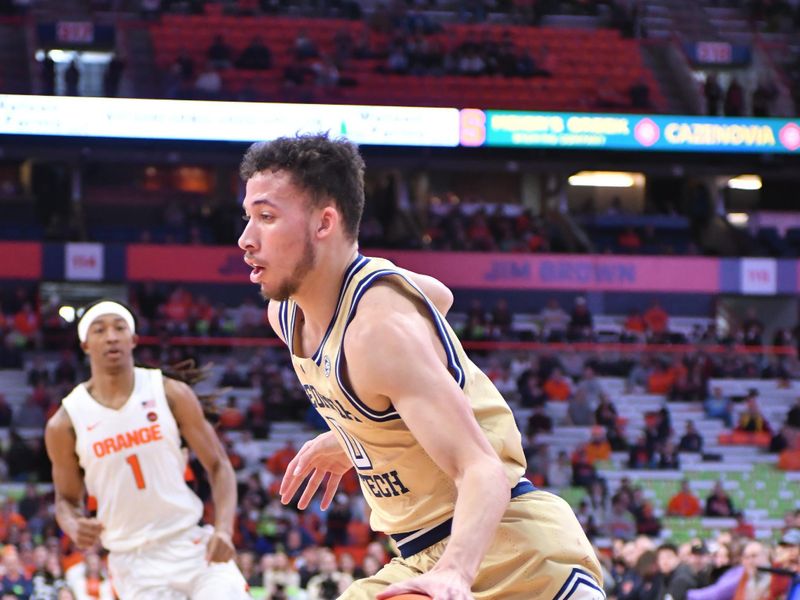 Feb 28, 2023; Syracuse, New York, USA; Georgia Tech Yellow Jackets guard Lance Terry (0) drives the ball along the base line against the Syracuse Orange in the first half at the JMA Wireless Dome. Mandatory Credit: Mark Konezny-USA TODAY Sports