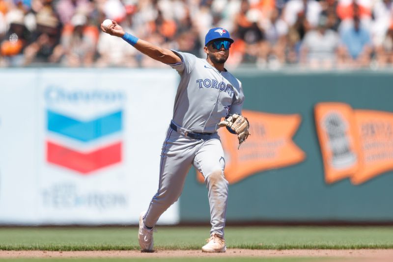 Jul 11, 2024; San Francisco, California, USA; Toronto Blue Jays shortstop Leo Jimenez (49) throws the ball to first base during the eighth inning against the San Francisco Giants at Oracle Park. Mandatory Credit: Sergio Estrada-USA TODAY Sports