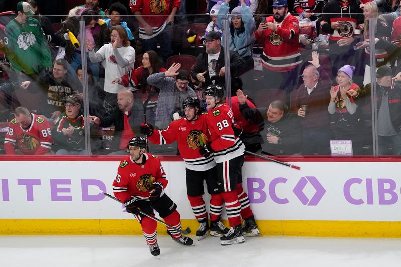 Jan 26, 2025; Chicago, Illinois, USA; Chicago Blackhawks center Frank Nazar (91) celebrates his goal against the Minnesota Wild during the third period at United Center. Mandatory Credit: David Banks-Imagn Images