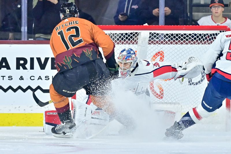 Jan 19, 2023; Tempe, Arizona, USA; Washington Capitals goaltender Darcy Kuemper (35) makes a save on Arizona Coyotes left wing Nick Ritchie (12) in the first period at Mullett Arena. Mandatory Credit: Matt Kartozian-USA TODAY Sports