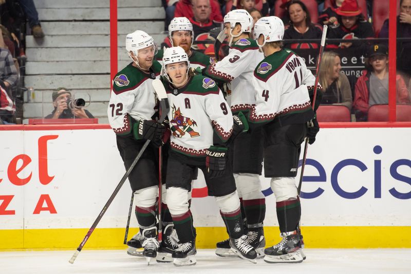 Oct 22, 2022; Ottawa, Ontario, CAN; Arizona Coyotes right wing Clayton Keller (9) celebrates with team his goal scored against the Ottawa Senators in the second period at the Canadian Tire Centre. Mandatory Credit: Marc DesRosiers-USA TODAY Sports