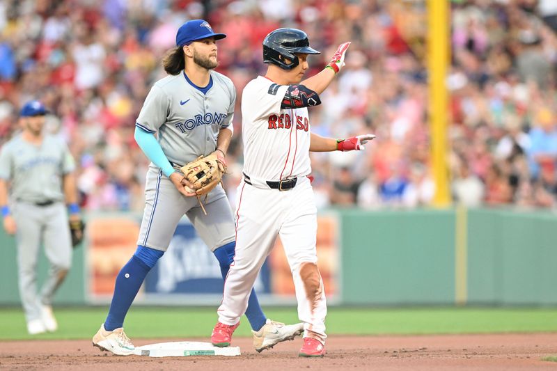 Jun 25, 2024; Boston, Massachusetts, USA; Boston Red Sox left fielder Masataka Yoshida (7) reacts after hitting a RBI double against the Toronto Blue Jays during the second inning at Fenway Park. Mandatory Credit: Brian Fluharty-USA TODAY Sports