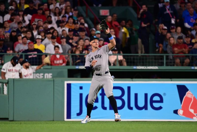 Jun 16, 2024; Boston, Massachusetts, USA;  ew York Yankees center fielder Aaron Judge (99) makes a catch for an out against the Boston Red Sox during the seventh inning at Fenway Park. Mandatory Credit: Eric Canha-USA TODAY Sports