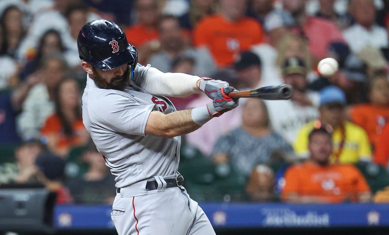 Aug 23, 2023; Houston, Texas, USA; Boston Red Sox catcher Connor Wong (12) hits a single during the fourth inning against the Houston Astros at Minute Maid Park. Mandatory Credit: Troy Taormina-USA TODAY Sports