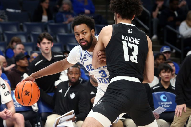 Jan 31, 2024; Memphis, Tennessee, USA; Memphis Tigers center Jordan Brown (3) dribbles as Rice Owls forward Andrew Akuchie (13) defends during the first half at FedExForum. Mandatory Credit: Petre Thomas-USA TODAY Sports