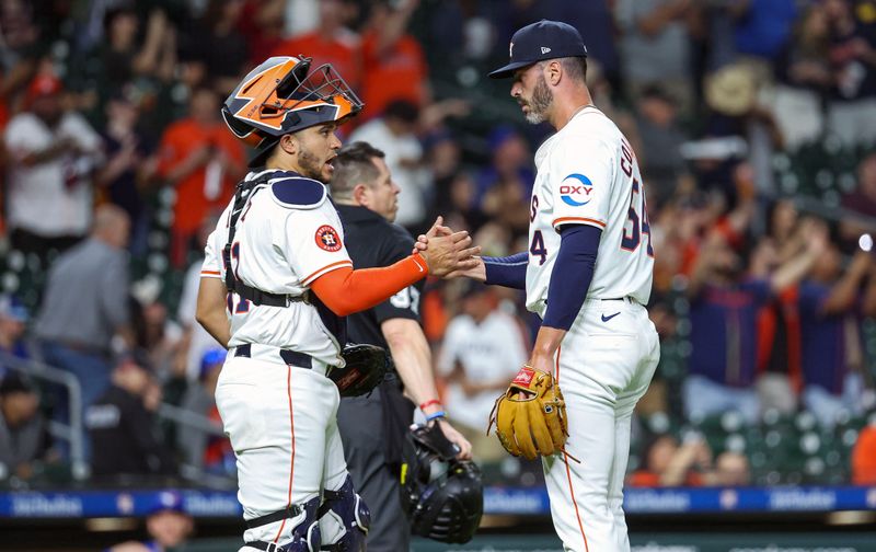 Apr 3, 2024; Houston, Texas, USA; Houston Astros relief pitcher Dylan Coleman (54) celebrates with catcher Yainer Diaz (21) after the game against the Toronto Blue Jays at Minute Maid Park. Mandatory Credit: Troy Taormina-USA TODAY Sports